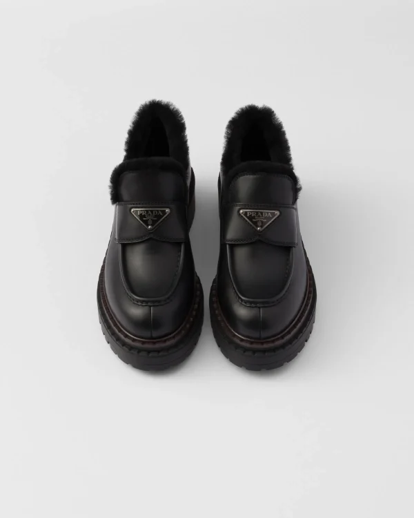 Loafers And Lace-ups*Prada Double Chocolate leather and shearling loafers Black