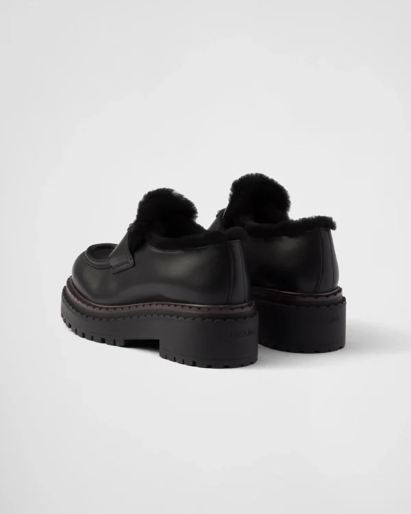 Loafers And Lace-ups*Prada Double Chocolate leather and shearling loafers Black