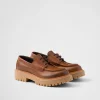 Loafers And Lace-ups*Prada Laced leather loafers Cognac