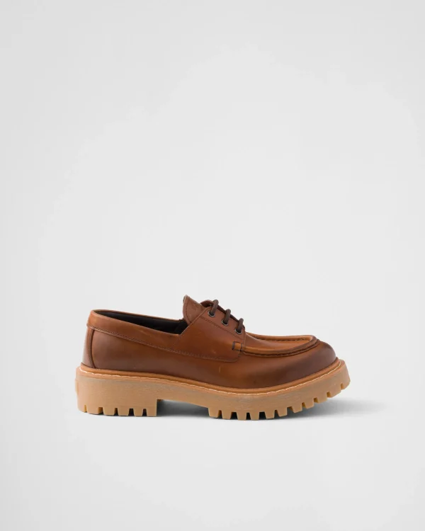 Loafers And Lace-ups*Prada Laced leather loafers Cognac