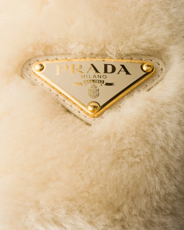 Hats And Gloves*Prada Shearling earmuffs Ecru